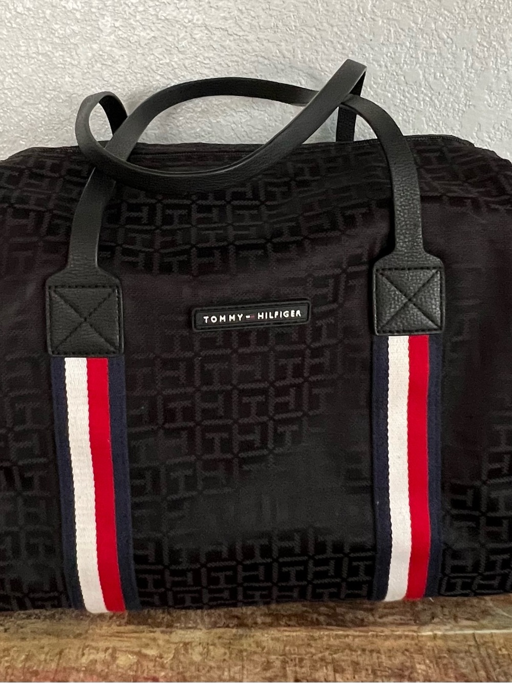 Tommy Hilfiger Black Duffel with Red, White & Navy Accent Straps